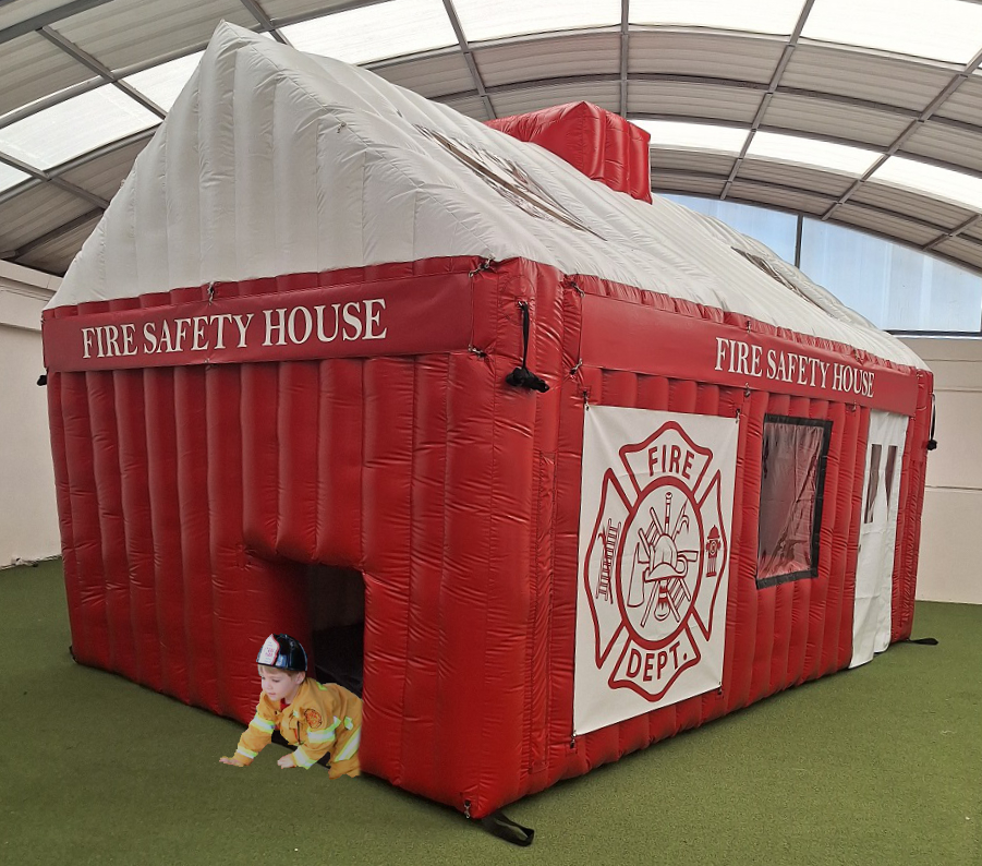 Child Crawling out of Inflatable Fire House for Fire Safety Practice