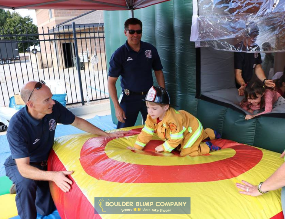 Firefighters Using Inflatable Fire Education House to Demonstrate Fire Safety